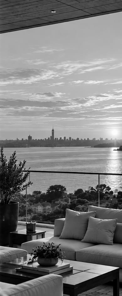A terrace looking across the water to the Manhattan skyline